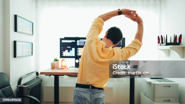 Man Working At Standing Desk Stock Photo - Download Image Now - Ergonomics, Place of Work, Standing Desk