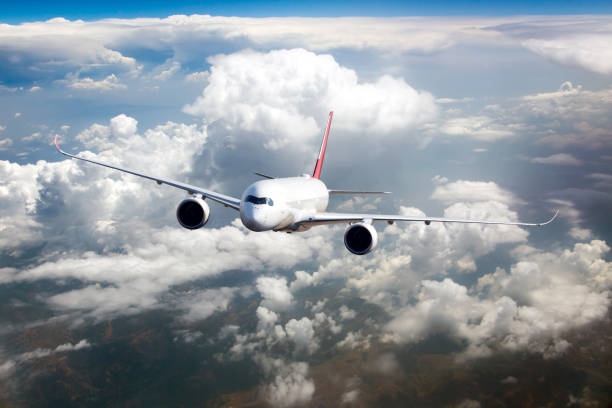 istock Passenger airplane in flight. Front view of aircraft. Right heeling. 1396490467