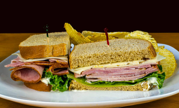 istock ham sandwich served with potato chips, 1396490526