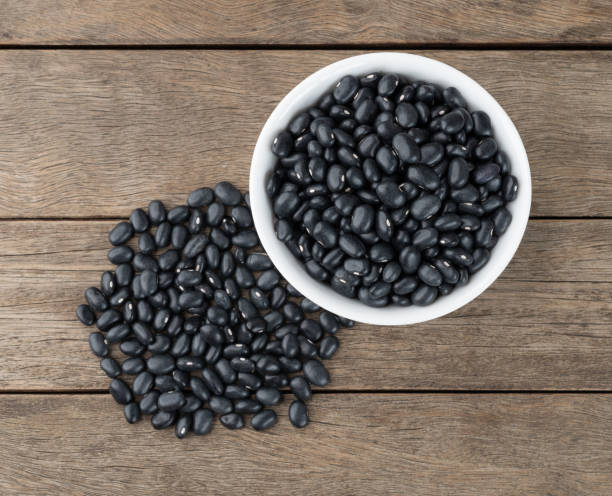 istock Black beans in a bowl over wooden table 1396490725