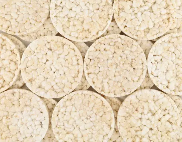 Round puffed rice crackers. Healthy food. Background and texture. Full frame.