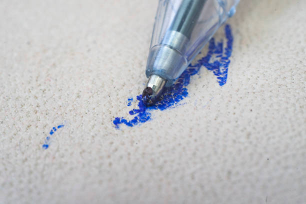 Ballpoint pen tip, scribbling on a white leather sofa, or car seats. macro