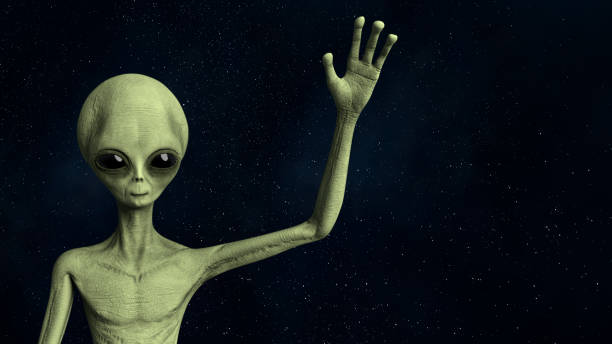 Friendly Alien greeting and waving hand stock photo