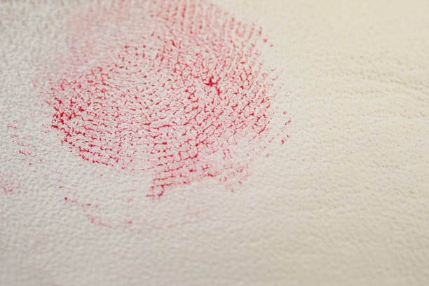 selective focus macro of a bloody fingerprint on fake white leather texture - fingerprint thumbprint identity red imagens e fotografias de stock