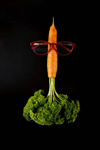 istock Carrot looking like a rocket with eye glasses and parsley flames, launching. 1396492902