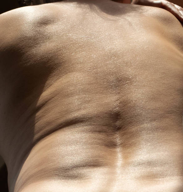 istock Back of a man in natural light 1396493269