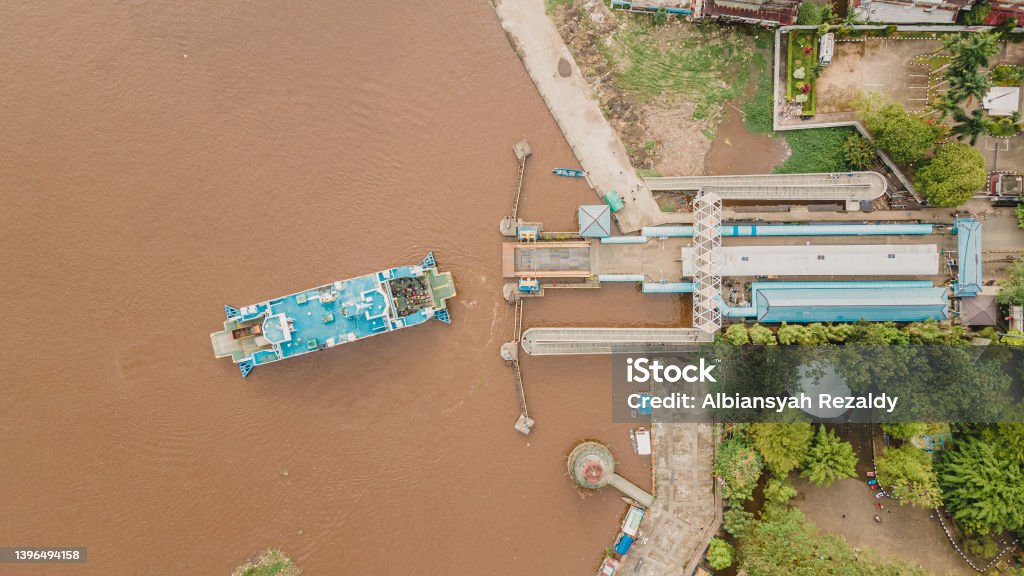 Passenger Ship Ready For Docking Passenger ship that docks in the harbor to drop people off. Docks at Kapuas river in Pontianak City Business Stock Photo
