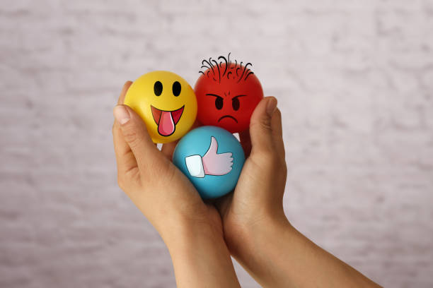 Woman holding emoji