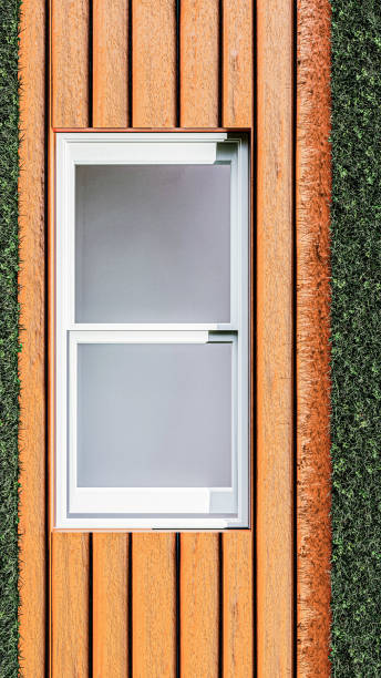 istock white window on wooden wall 1396494822