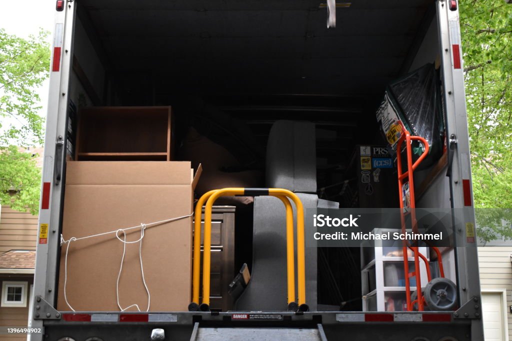 Moving Van Packed A moving van packed with furniture and belongings Moving Van Stock Photo