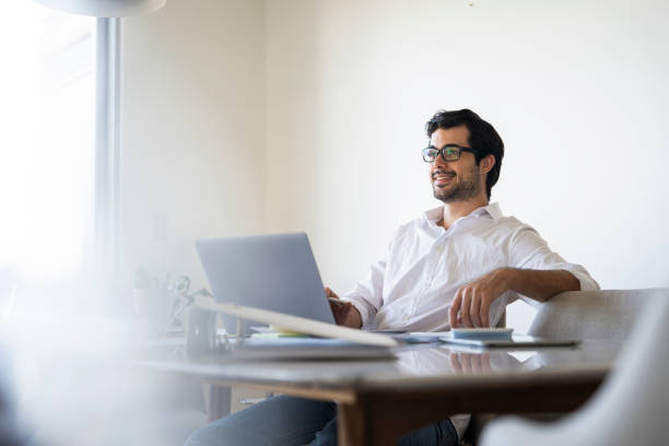 istock Young businessman working on his laptop in office 1396495743