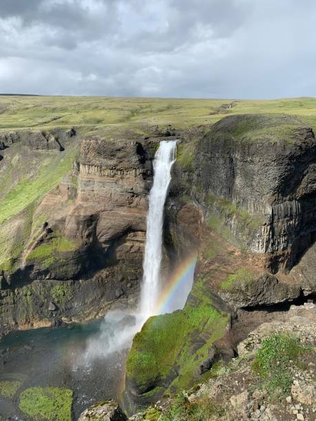 Rainbow Waterfall Iceland A beautiful waterfall that includes a rainbow hraunfossar stock pictures, royalty-free photos & images