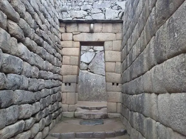 Photo of Ruins of the ancient Inca city machu picchu in fog, Peru