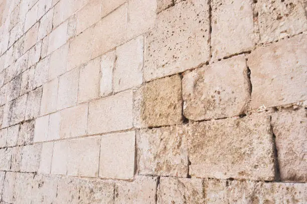 Photo of ashlar stone wall belonging to a religious construction