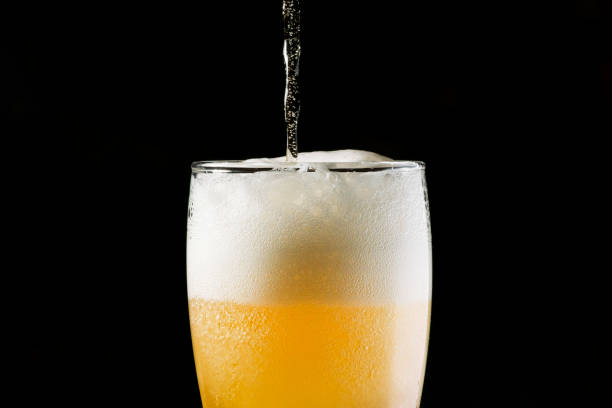 istock Close-up Beer isolated in black background 1396501056