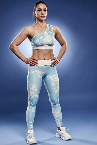 istock Strong athletic woman on blue background 1396501132