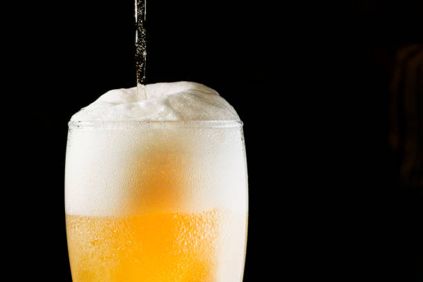 istock Close-up Beer isolated in black background 1396501163