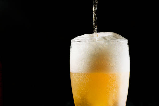 istock Close-up Beer isolated in black background 1396501177