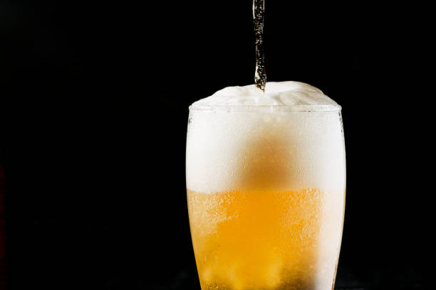 Close-up Beer isolated in black background stock photo
