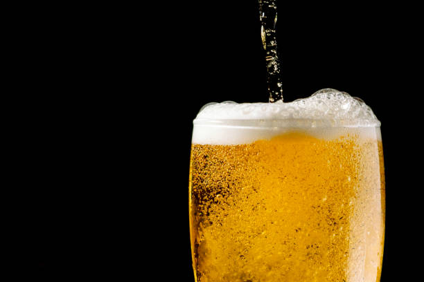 istock Close-up Beer isolated in black background 1396501309