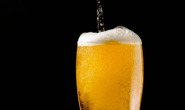 istock Close-up Beer isolated in black background 1396501318