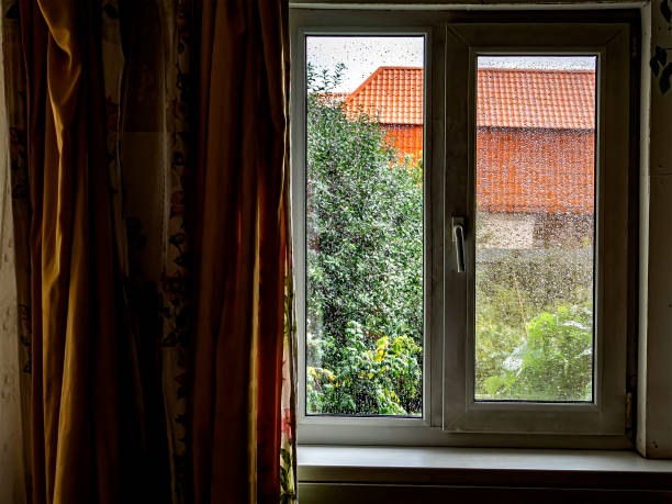 istock window with transparent raindrops on the glass 1396501361