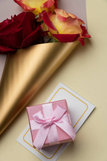 istock Pink gift box and  blossom rose. Celebration concept, greeting objects flat lay 1396501430