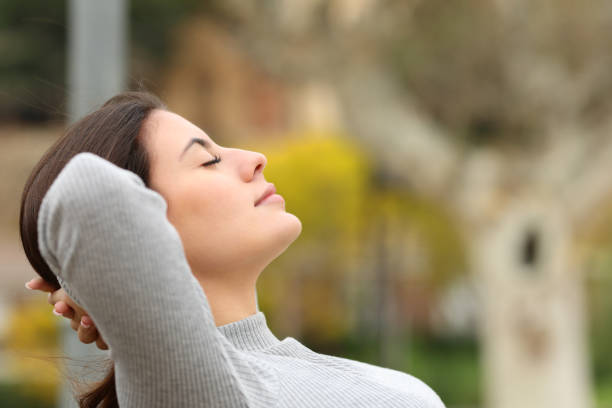 istock Relaxed woman resting sitting in a park 1396502816