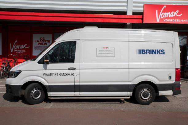 Brinks Company In Front Of Vomar Supermarket Van At Amsterdam The Netherlands Brinks Company In Front Of Vomar Supermarket Van At Amsterdam The Netherlands 22-3-2022 armoured truck stock pictures, royalty-free photos & images