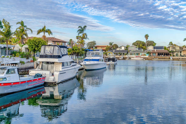 istock Yachts on serene water that reflects the cloudy blue sky in Huntington Beach CA 1396503436
