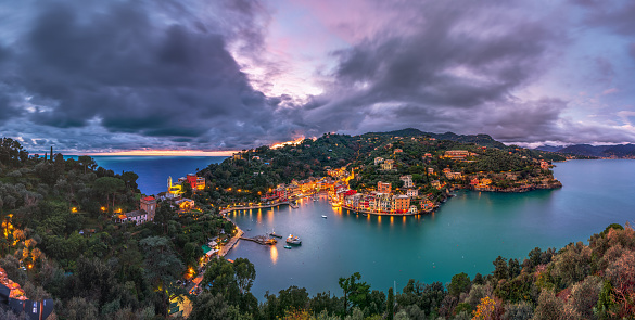Portofino, Italy fishing village and commune in the Metropolitan City of Genova at dusk.
