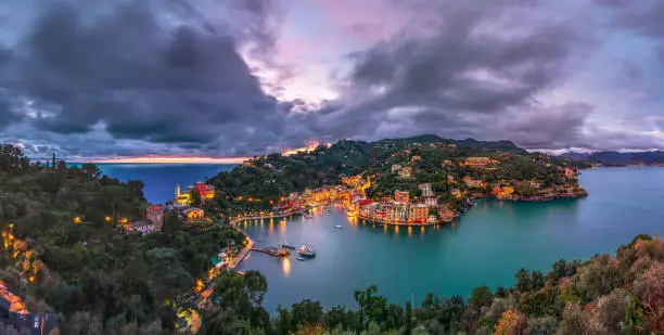 Portofino, Italy fishing village and commune in the Metropolitan City of Genova at dusk.