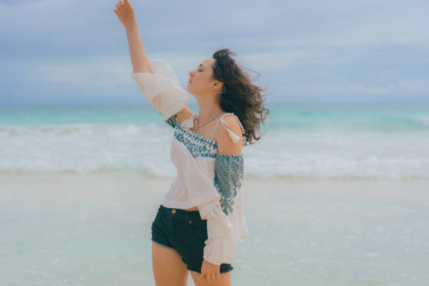 istock Woman  dancing on the beach in Tulum 1396505361