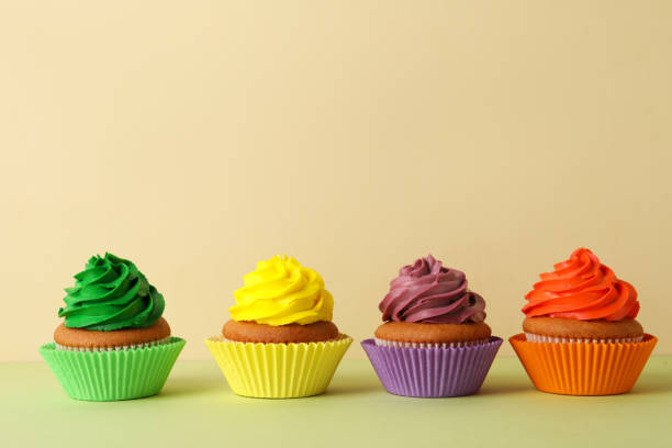 istock Different delicious cupcakes on color background, space for text 1396506684