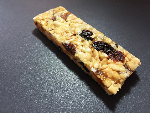 Granola protein bar on the black background