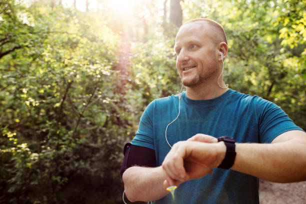 istock Man using Smart Watch measuring heart rate. 1396508851