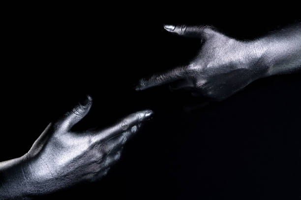 istock Covered in metallic paint on dark background 1396510413