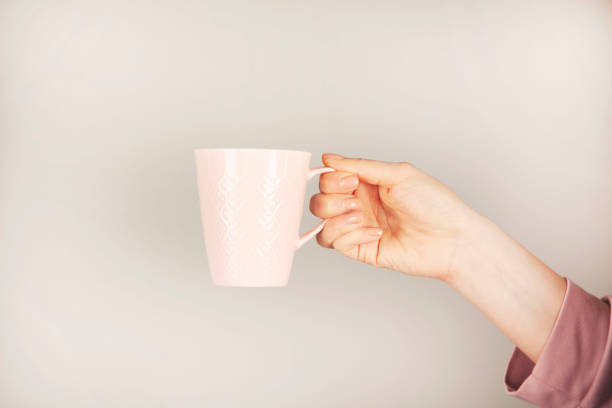 woman hand holding cup of tea or coffee