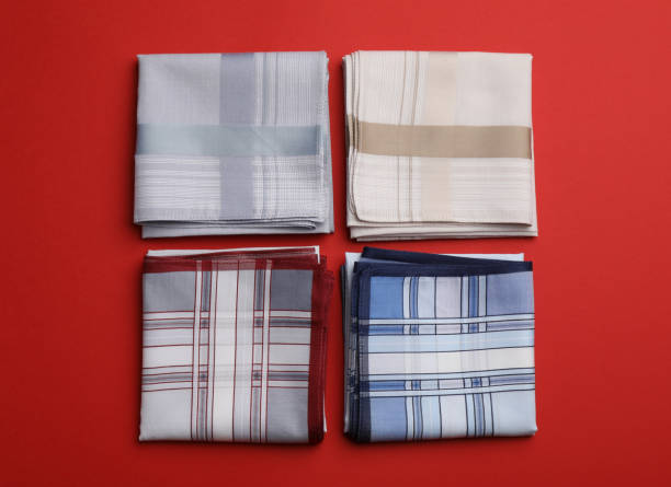 istock Stylish handkerchiefs on red background, flat lay 1396511646