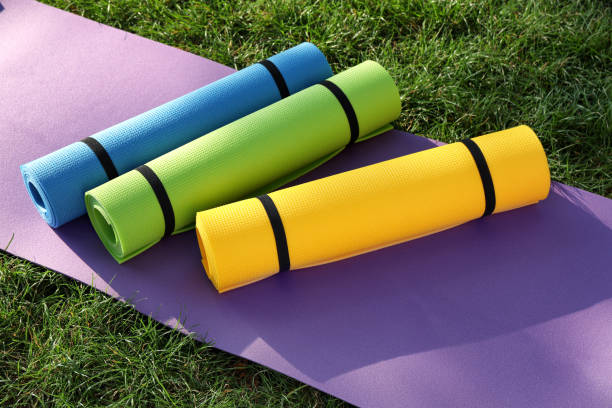 istock Bright exercise mats on fresh green grass outdoors 1396512879