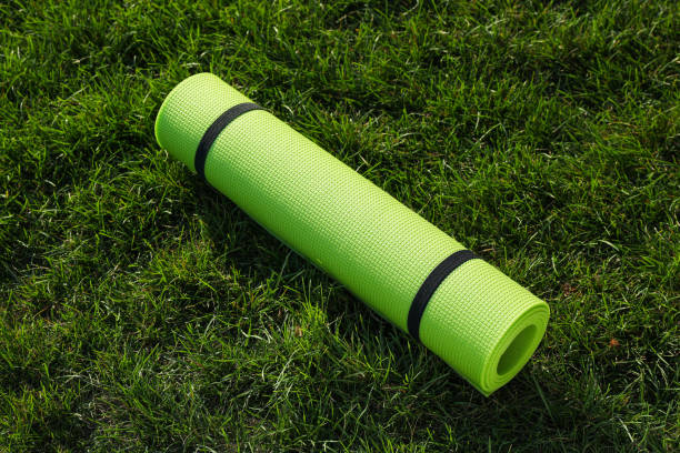 istock Bright exercise mat on fresh green grass outdoors 1396513243