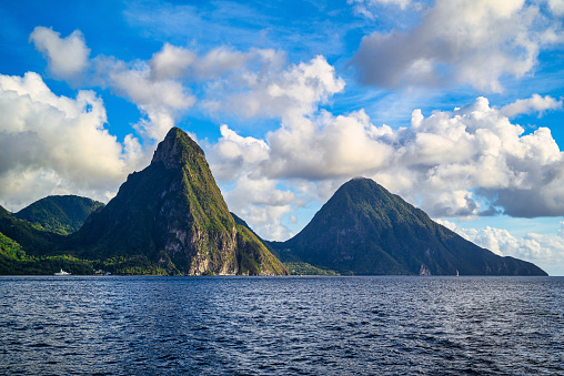 A view of the mountains from Petit Piton on St. Lucia in the Caribbean under blue skies