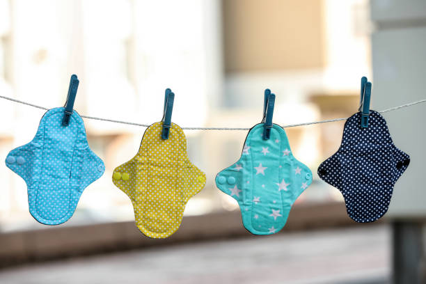 Many different menstrual cloth pads hanging on rope outdoors Many different menstrual cloth pads hanging on rope outdoors sanitary napkin stock pictures, royalty-free photos & images