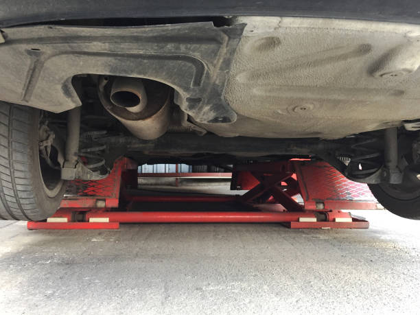 istock Car on the lift at the car service 1396514590