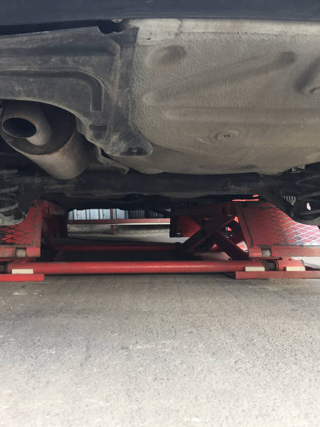 istock Car on the lift at the car service 1396514604