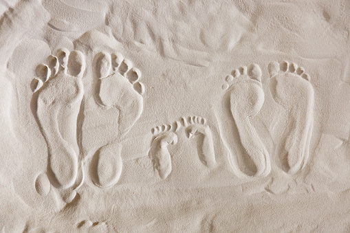 Love symbol in the sand at the beach.