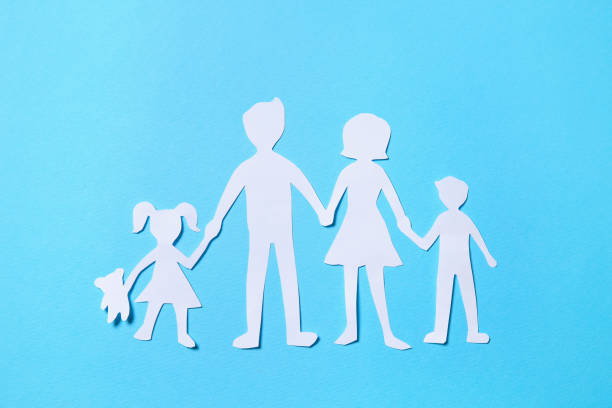 istock Paper family figures on light blue background, top view 1396514859