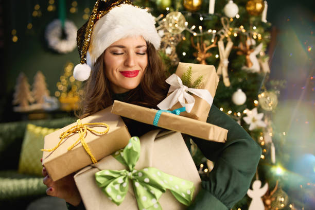 istock smiling elegant female in modern living room 1396514926