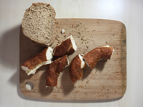 Wholegrain toast and bagel sandwich on the cutting board, preparing sandwiches
