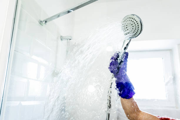istock Hand with glove cleaning the shower 1396517020